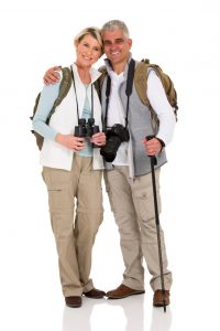 lovely senior hiking couple hugging 