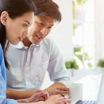 Couple looking at a laptop